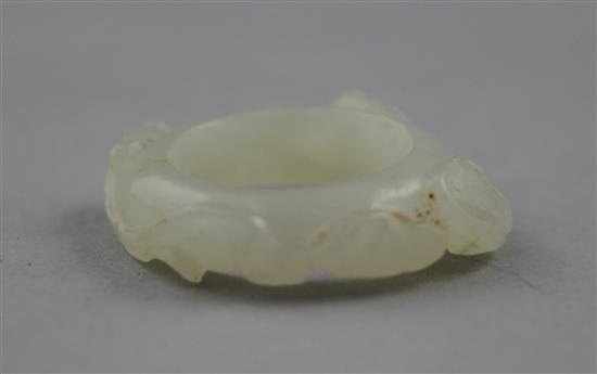 A Chinese white jade archers thumb ring, 18th / 19th century, 3cm